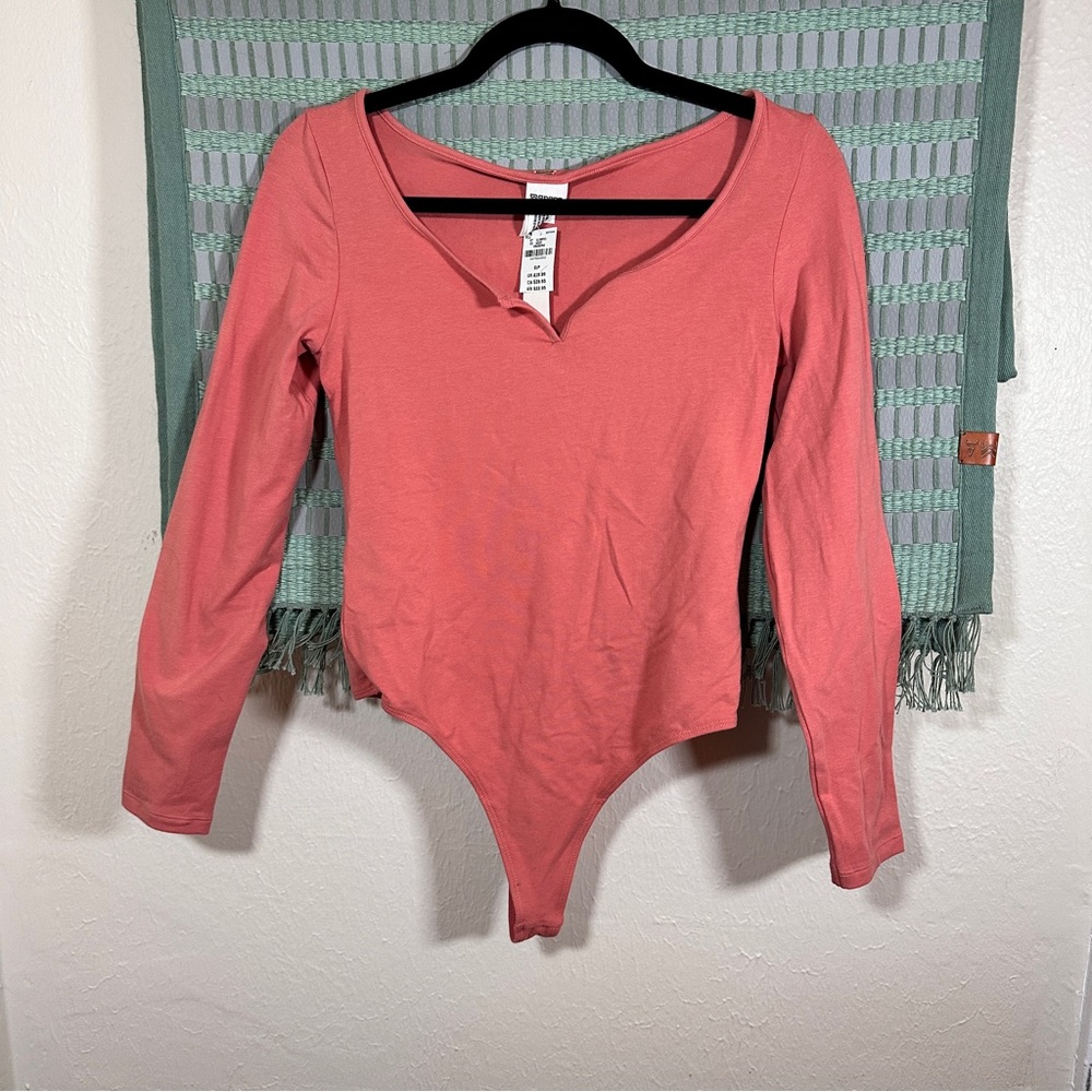 PINK | NWT Pink long-sleeved thong body suit
